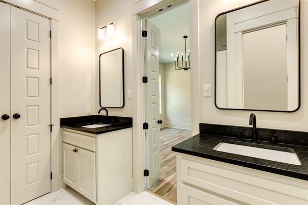 Bathroom, Dual Sink Vanities, Interior, Marble, Pendant Lights, Recessed Lighting, Wood Texture Flooring