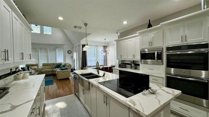 Dining room, Interior, Kitchen, Living room, Pendant Lights, Recessed Lighting, Stainless Steel Appliances, Wood Texture Flooring