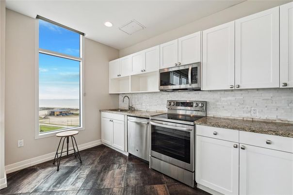 Interior, Kitchen, Recessed Lighting, Stainless Steel Appliances, Water, Wood Texture Flooring