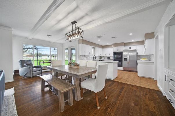 Dining room, Interior, Kitchen, Pendant Lights, Recessed Lighting, Stainless Steel Appliances, Wood Texture Flooring