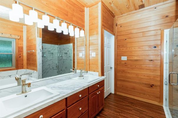 Bathroom, Dual Sink Vanities, Glass Shower, Interior, Marble Walls, Wooden Ceilings, Wood Texture Flooring, Wooden Walls