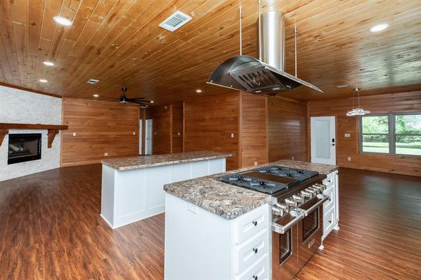 Fireplace, Interior, Kitchen, Pendant Lights, Recessed Lighting, Stainless Steel Appliances, Wooden Ceilings, Wood Texture Flooring, Wooden Walls