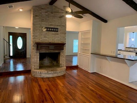 Empty room, Fireplace, Interior, Recessed Lighting, Stone Walls, Wooden Beams, Wood Texture Flooring