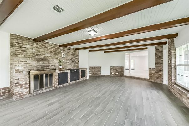 Empty room, Fireplace, Interior, Stone Walls, Wooden Beams, Wood Texture Flooring