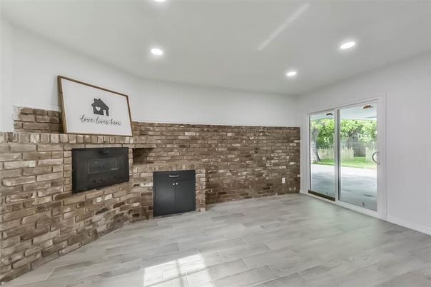 Empty room, Fireplace, Interior, Recessed Lighting, Stone Walls, Wood Texture Flooring