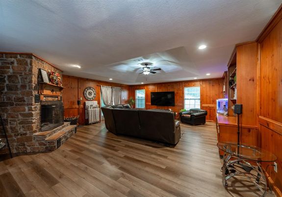 Fireplace, Interior, Living room, Recessed Lighting, Stone Walls, Wood Texture Flooring, Wooden Walls