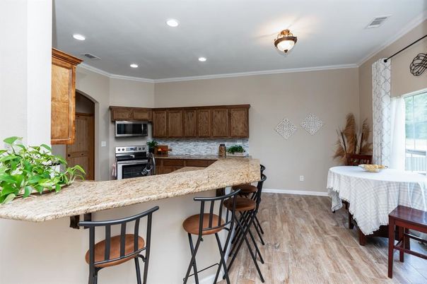Dining room, Interior, Kitchen, Recessed Lighting, Stainless Steel Appliances, Wood Texture Flooring