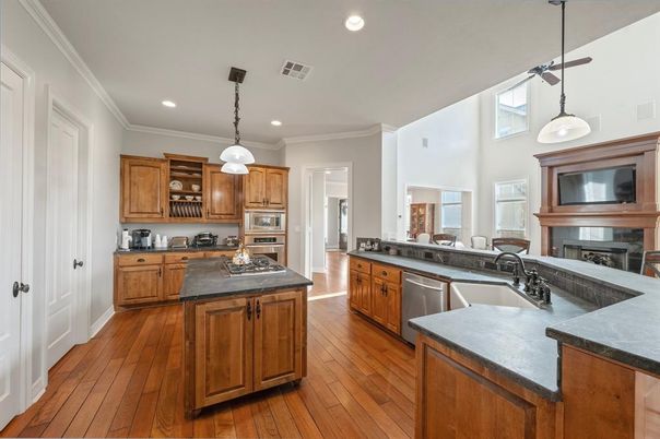 Fireplace, Interior, Kitchen, Pendant Lights, Recessed Lighting, Stainless Steel Appliances, Wood Texture Flooring