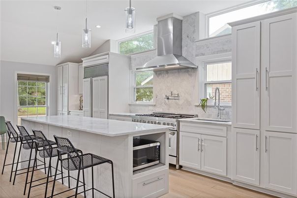 Interior, Kitchen, Marble Walls, Pendant Lights, Recessed Lighting, Stainless Steel Appliances, Wood Texture Flooring
