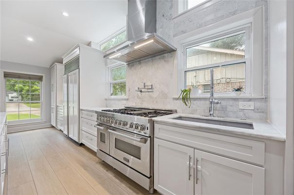 Interior, Kitchen, Marble Walls, Recessed Lighting, Stainless Steel Appliances, Wood Texture Flooring