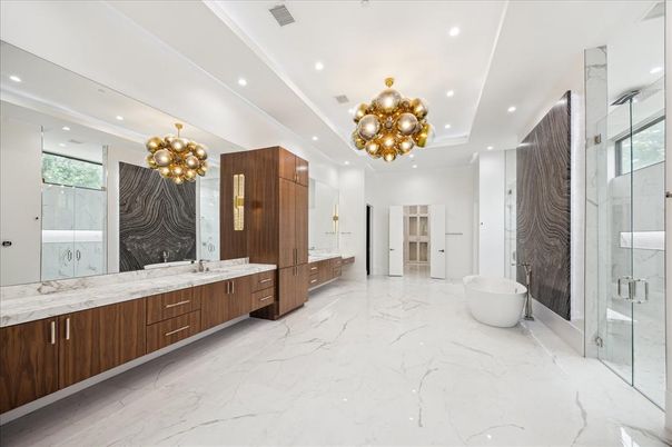 Bathroom, Chandelier, Dual Sink Vanities, Free Standing Baths, Glass Shower, Interior, Marble, Marble Walls, Recessed Lighting