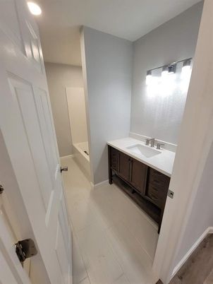 Bathroom, Dual Sink Vanities, Interior, Recessed Lighting, Wood Texture Flooring