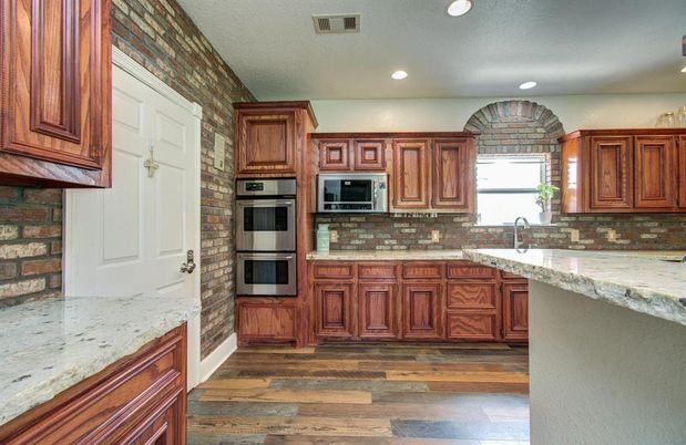 Interior, Kitchen, Recessed Lighting, Stainless Steel Appliances, Stone Walls, Wood Texture Flooring