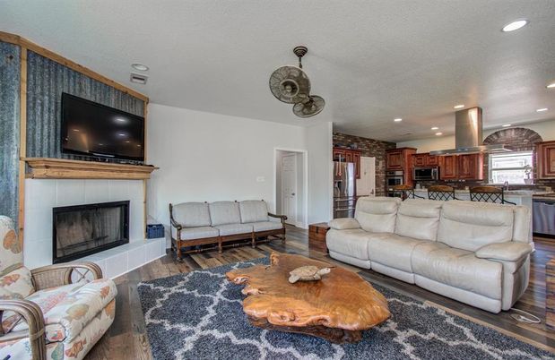 Fireplace, Interior, Kitchen, Living room, Recessed Lighting, Stone Walls, Wood Texture Flooring