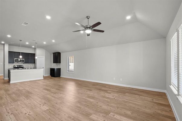 Empty room, Interior, Kitchen, Pendant Lights, Recessed Lighting, Stainless Steel Appliances, Wood Texture Flooring