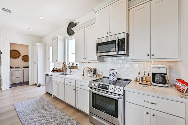 Interior, Kitchen, Recessed Lighting, Stainless Steel Appliances, Washer, Wood Texture Flooring