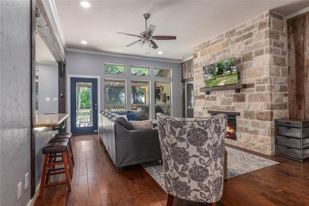 Fireplace, Interior, Living room, Recessed Lighting, Stone Walls, Wood Texture Flooring