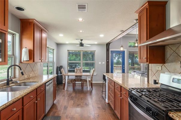 Dining room, Interior, Kitchen, Pendant Lights, Recessed Lighting, Stainless Steel Appliances, Wood Texture Flooring