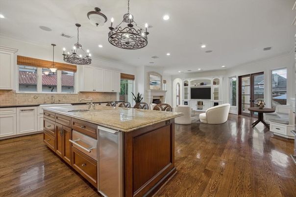 Chandelier, Fireplace, Interior, Kitchen, Living room, Recessed Lighting, Wood Texture Flooring