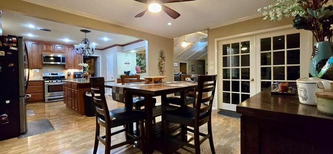 Chandelier, Dining room, Interior, Kitchen, Pendant Lights, Recessed Lighting, Stainless Steel Appliances, Wood Texture Flooring