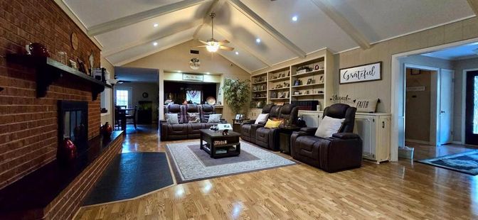 Fireplace, Interior, Living room, Recessed Lighting, Stone Walls, Wood Texture Flooring