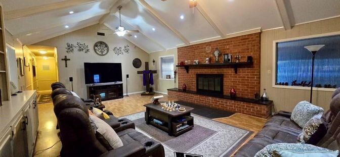 Fireplace, Interior, Living room, Recessed Lighting, Stone Walls, Wood Texture Flooring