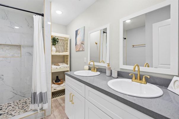 Bathroom, Dual Sink Vanities, Interior, Marble Walls, Recessed Lighting, Wood Texture Flooring