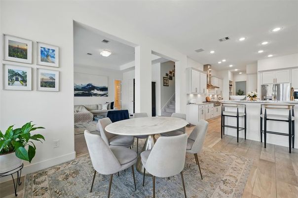 Dining room, Interior, Kitchen, Living room, Recessed Lighting, Stainless Steel Appliances, Wood Texture Flooring