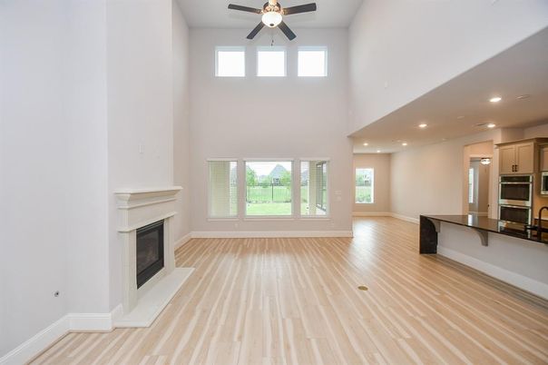 Empty room, Fireplace, Interior, Kitchen, Recessed Lighting, Wood Texture Flooring