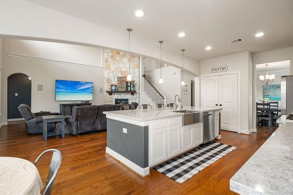 Chandelier, Dining room, Fireplace, Interior, Kitchen, Living room, Pendant Lights, Recessed Lighting, Wood Texture Flooring
