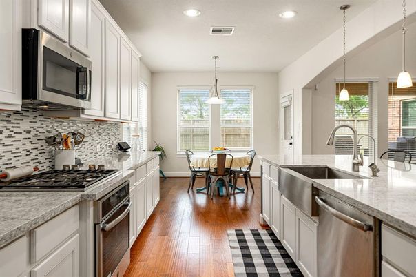 Dining room, Interior, Kitchen, Pendant Lights, Recessed Lighting, Stainless Steel Appliances, Wood Texture Flooring