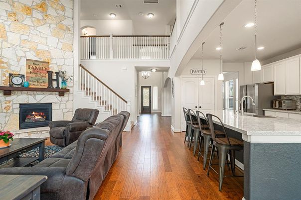 Fireplace, Interior, Kitchen, Living room, Pendant Lights, Recessed Lighting, Stone Walls, Wood Texture Flooring