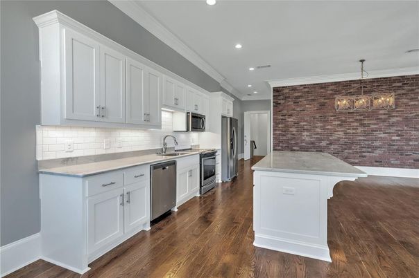Interior, Kitchen, Pendant Lights, Recessed Lighting, Stainless Steel Appliances, Stone Walls, Wood Texture Flooring