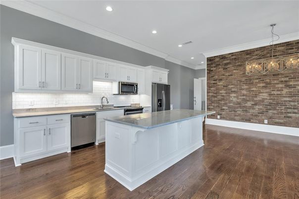 Interior, Kitchen, Pendant Lights, Recessed Lighting, Stainless Steel Appliances, Stone Walls, Wood Texture Flooring