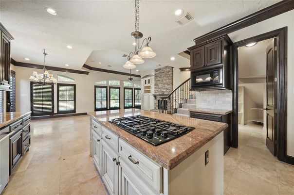 Chandelier, Fireplace, Interior, Kitchen, Pendant Lights, Recessed Lighting, Stainless Steel Appliances