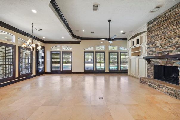 Chandelier, Empty room, Fireplace, Interior, Recessed Lighting, Stone Walls