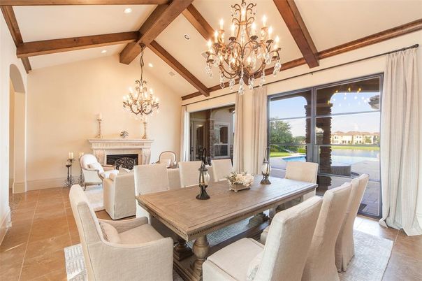 Chandelier, Dining room, Fireplace, Interior, Living room, Recessed Lighting, Water, Wooden Beams