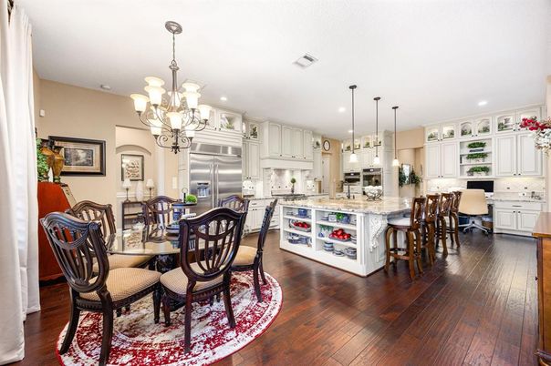 Chandelier, Dining room, Interior, Kitchen, Pendant Lights, Recessed Lighting, Stainless Steel Appliances, Wood Texture Flooring