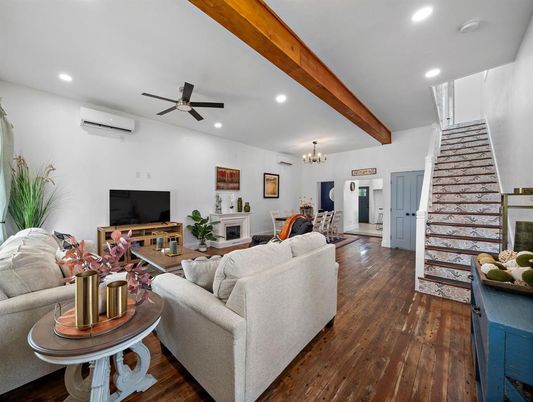 Chandelier, Dining room, Fireplace, Interior, Living room, Recessed Lighting, Wooden Beams, Wood Texture Flooring