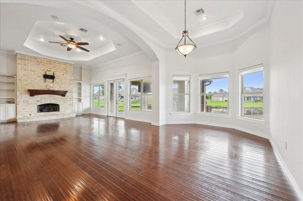 Empty room, Fireplace, Interior, Pendant Lights, Recessed Lighting, Stone Walls, Wood Texture Flooring