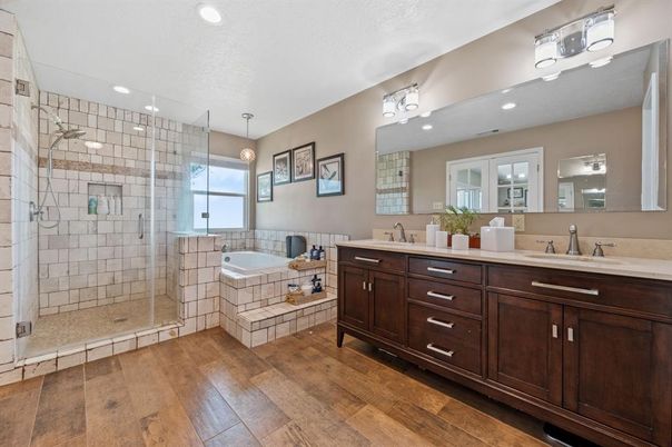 Bathroom, Dual Sink Vanities, Glass Shower, Interior, Pendant Lights, Recessed Lighting, Wood Texture Flooring