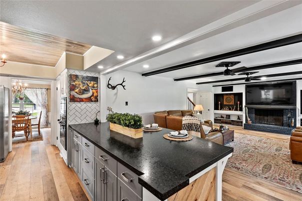 Chandelier, Dining room, Fireplace, Interior, Living room, Recessed Lighting, Wooden Ceilings, Wood Texture Flooring