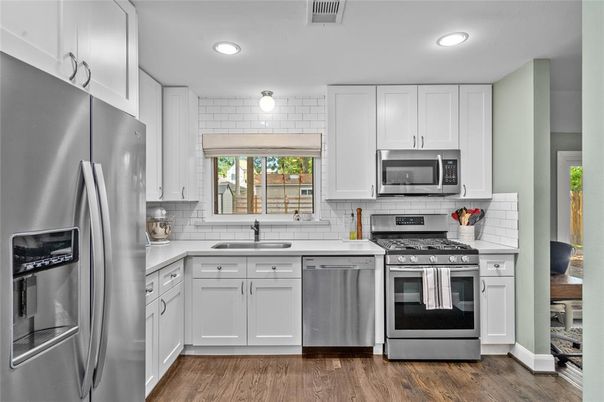 Interior, Kitchen, Recessed Lighting, Stainless Steel Appliances, Wood Texture Flooring