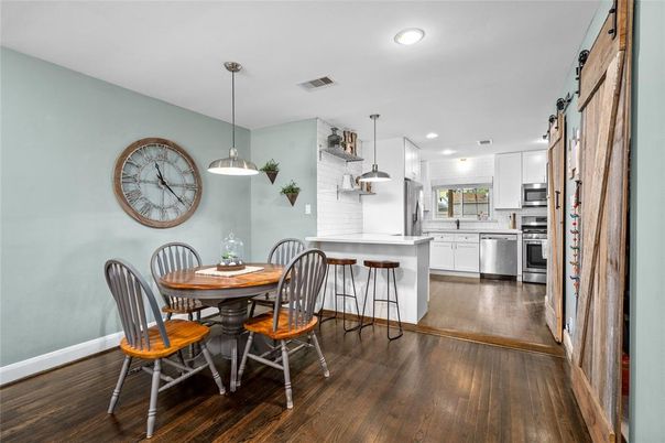 Dining room, Interior, Kitchen, Pendant Lights, Recessed Lighting, Stainless Steel Appliances, Wood Texture Flooring