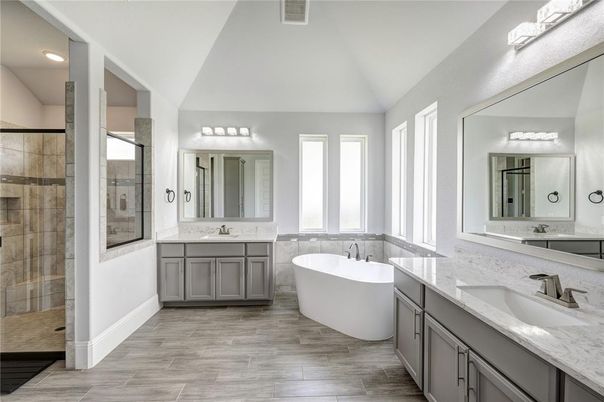 Bathroom, Dual Sink Vanities, Free Standing Baths, Glass Shower, Interior, Recessed Lighting, Wood Texture Flooring