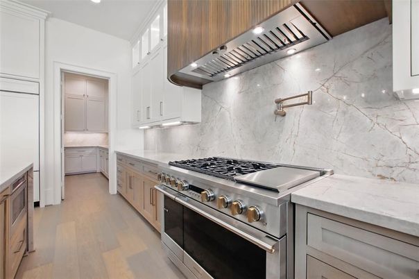 Interior, Kitchen, Marble Walls, Recessed Lighting, Stainless Steel Appliances, Wood Texture Flooring