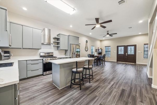 Dining room, Interior, Kitchen, Recessed Lighting, Stainless Steel Appliances, Wood Texture Flooring