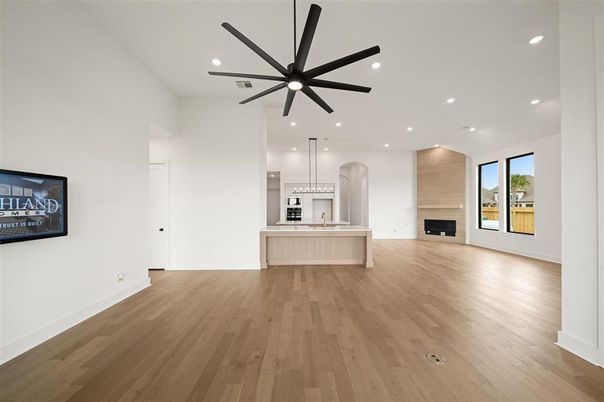 Empty room, Fireplace, Interior, Kitchen, Pendant Lights, Recessed Lighting, Wood Texture Flooring