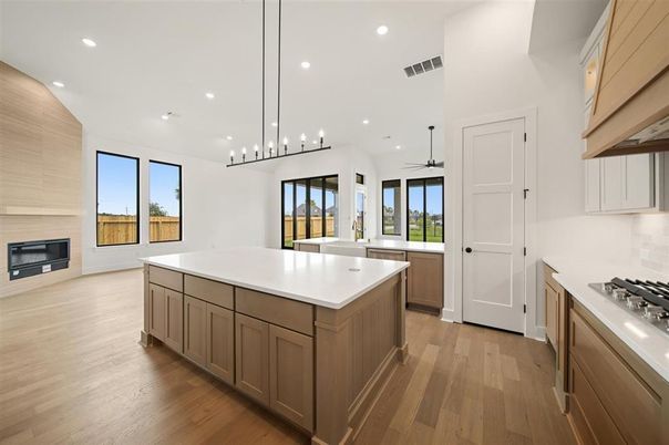 Fireplace, Interior, Kitchen, Pendant Lights, Recessed Lighting, Stainless Steel Appliances, Wood Texture Flooring