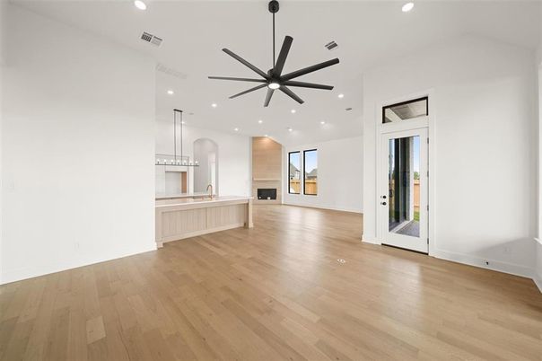 Empty room, Fireplace, Interior, Kitchen, Pendant Lights, Recessed Lighting, Wood Texture Flooring